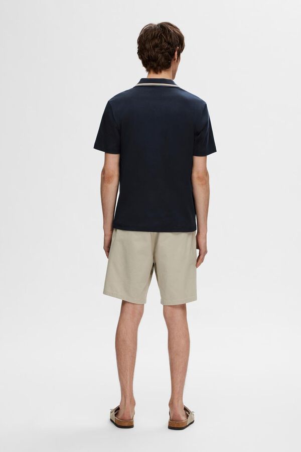 Selected short sleeve V- neck polo shirt made from 100% organic cotton.  Navy