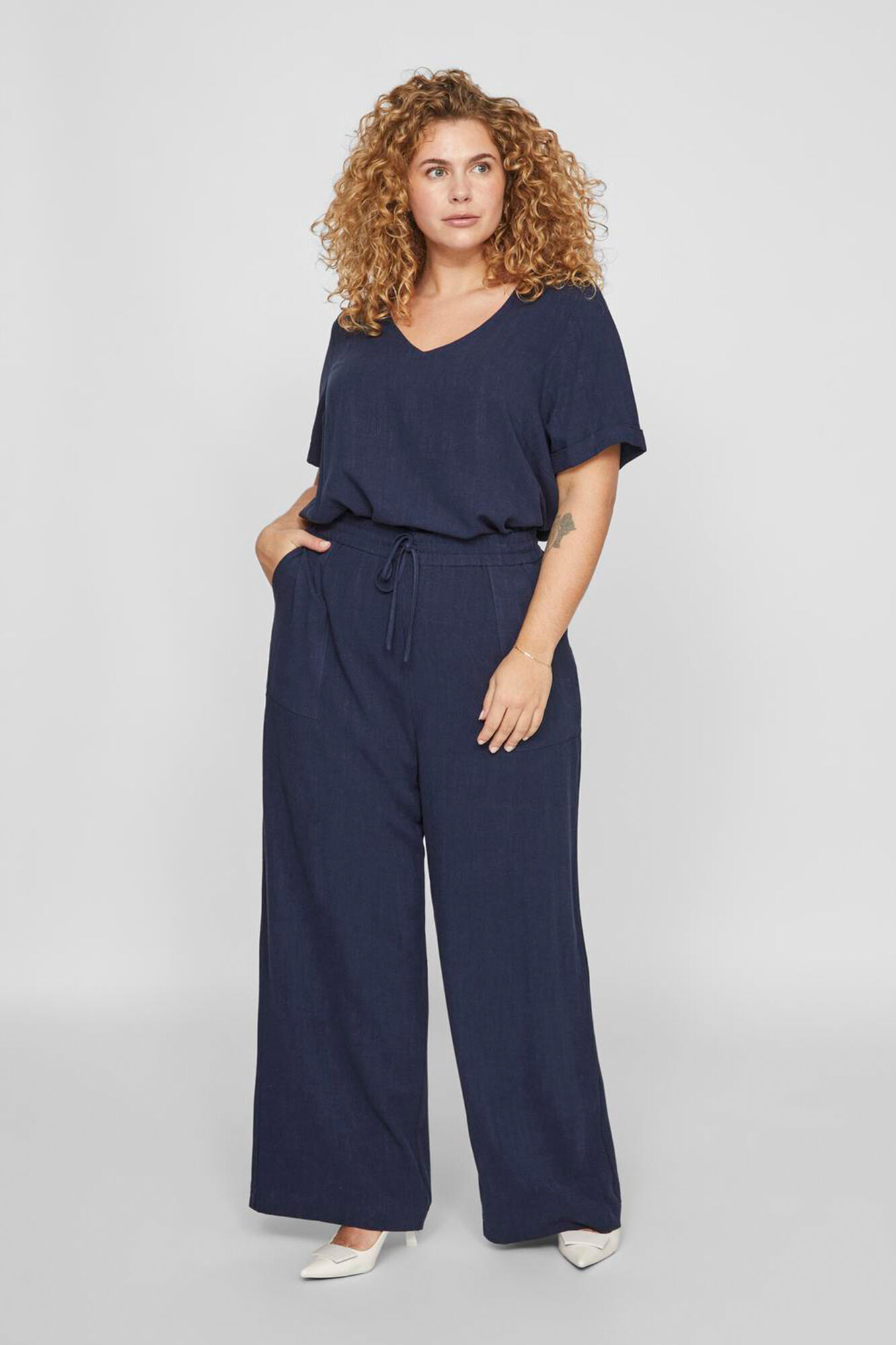 Pantalon ancho de lino curve Pantalones de mujer Cortefiel