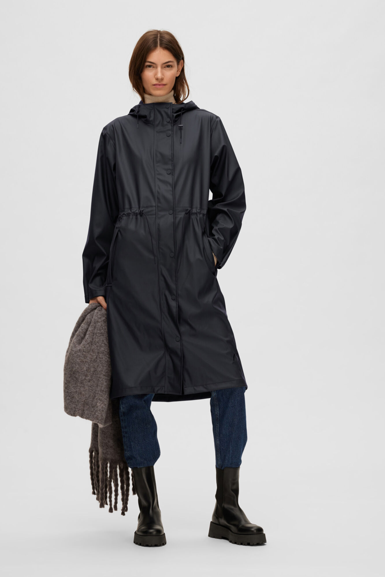 Raincoat with hood and adjustable waist. Women s coats and