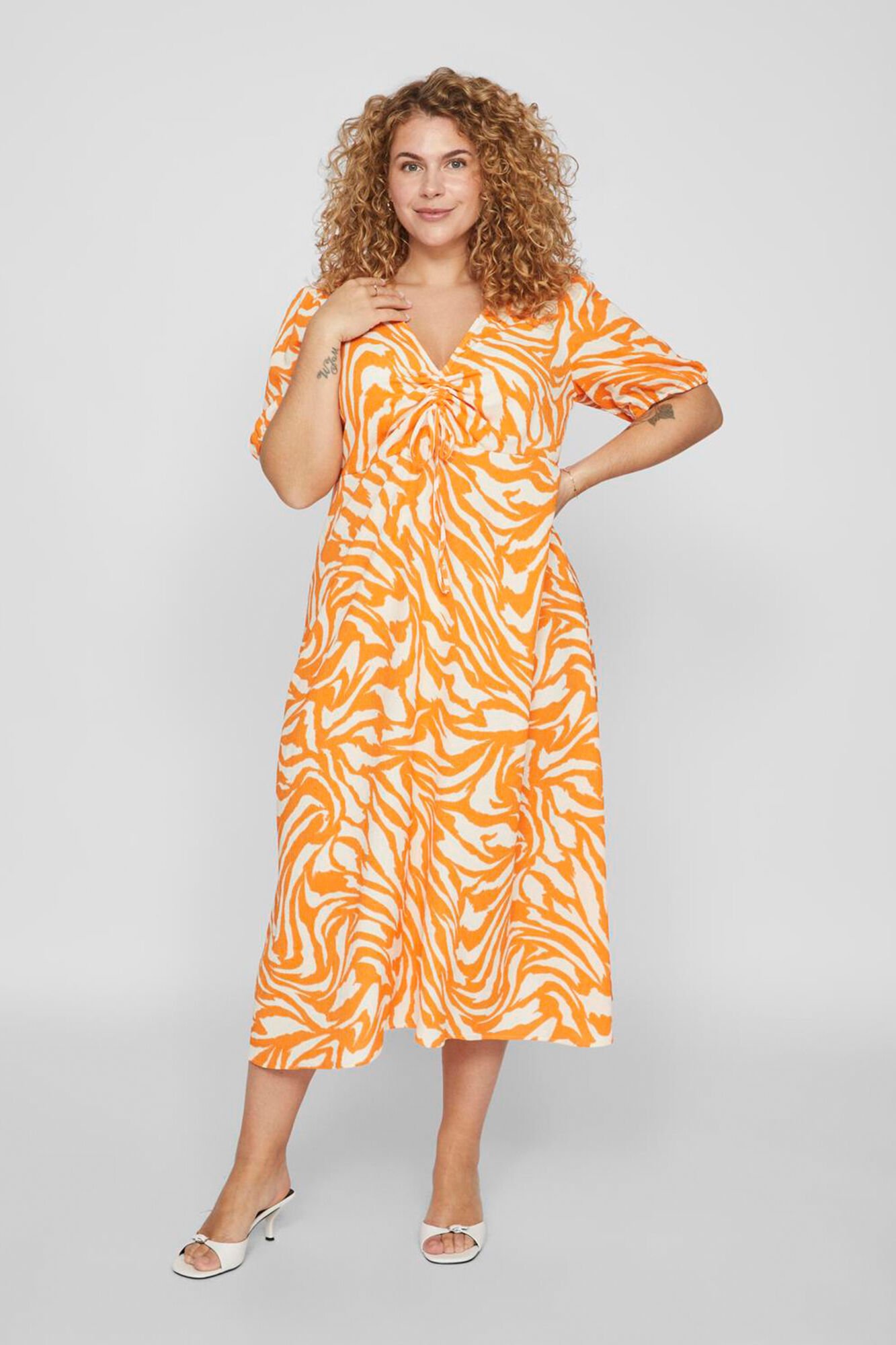 Curve printed short sleeved midi dress Women s dresses and jumpsuits Cortefiel