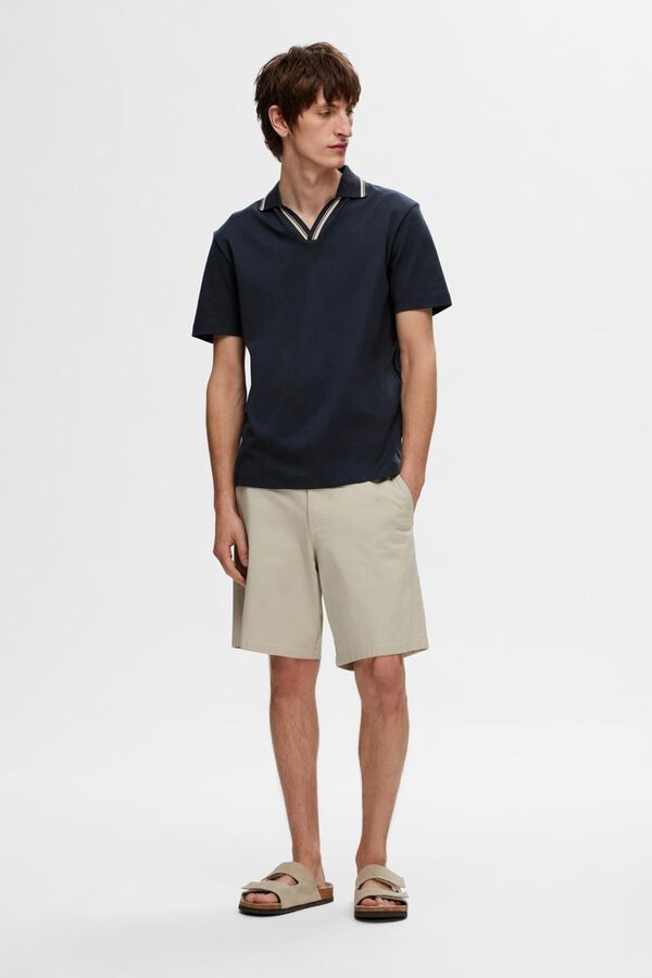 Selected short sleeve V- neck polo shirt made from 100% organic cotton.  Navy