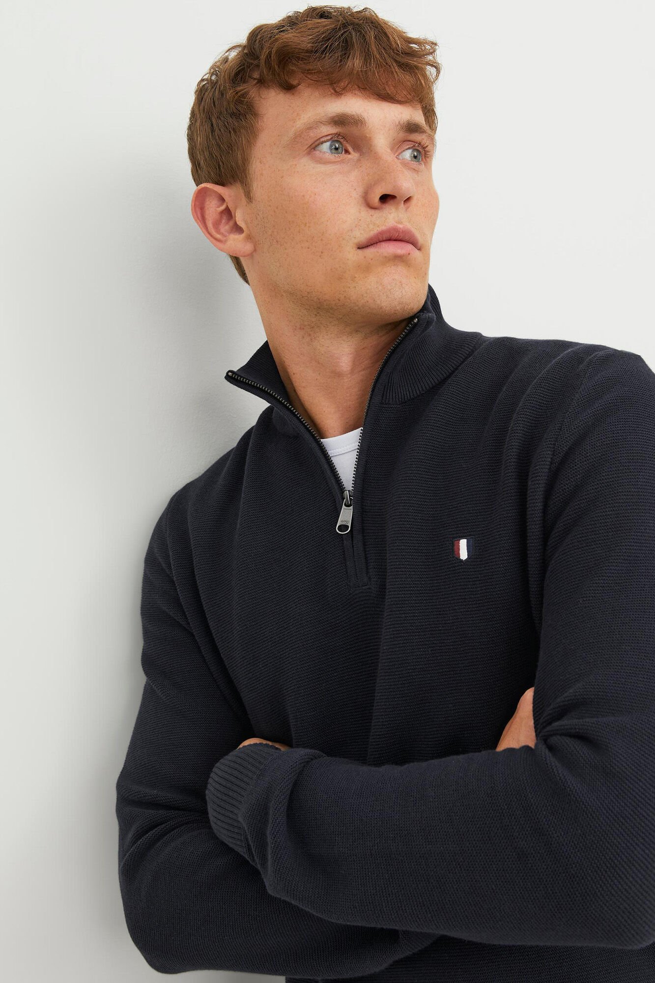 100 cotton structured jumper with a high neck and zip fastening