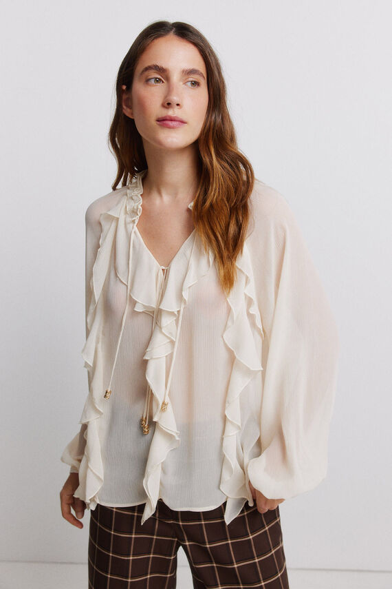 Blusa fluida con volantes