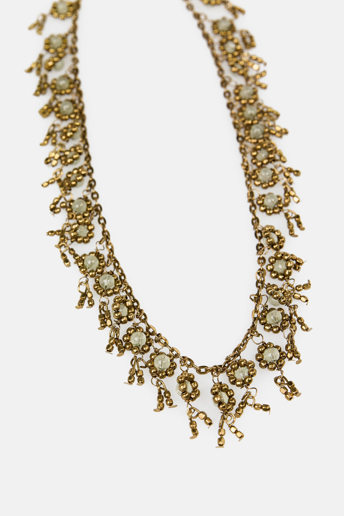 Hoss Intropia Lubna. Colar curto flores banhado a ouro