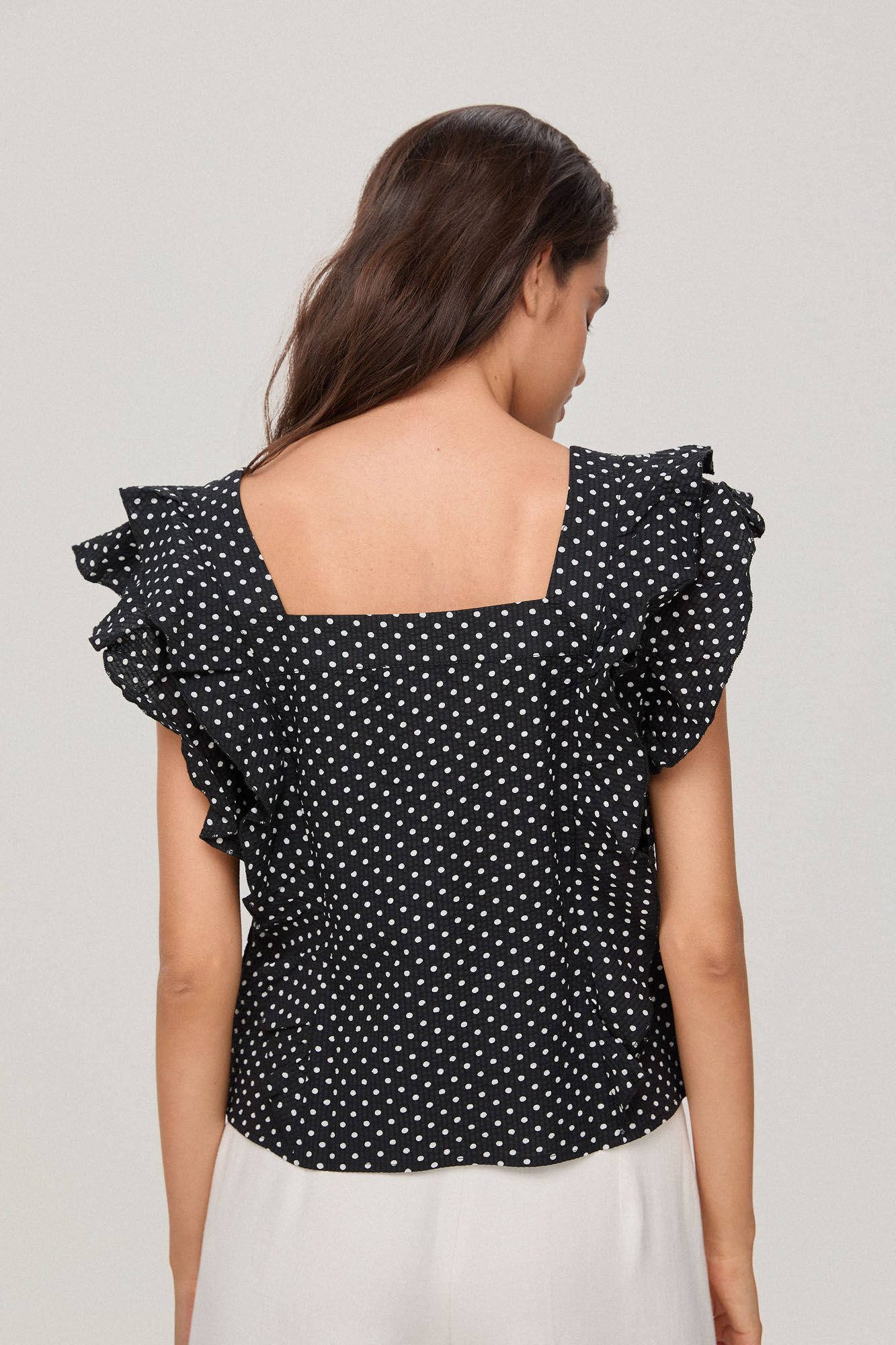 Polka-dot top with ruffles | Women's blouses | Cortefiel