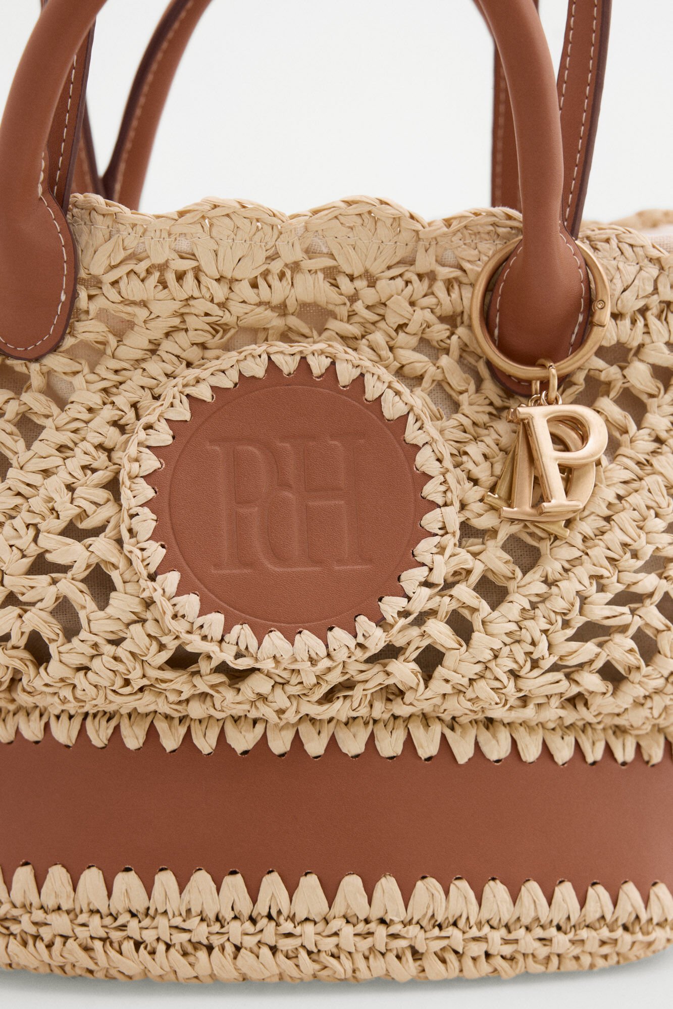 Pedro del Hierro Raffia-effect braided logo basket bag