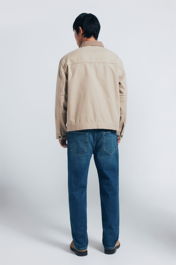Springfield Calça jeans reta com lavagem escura e tingimento excessivo azul