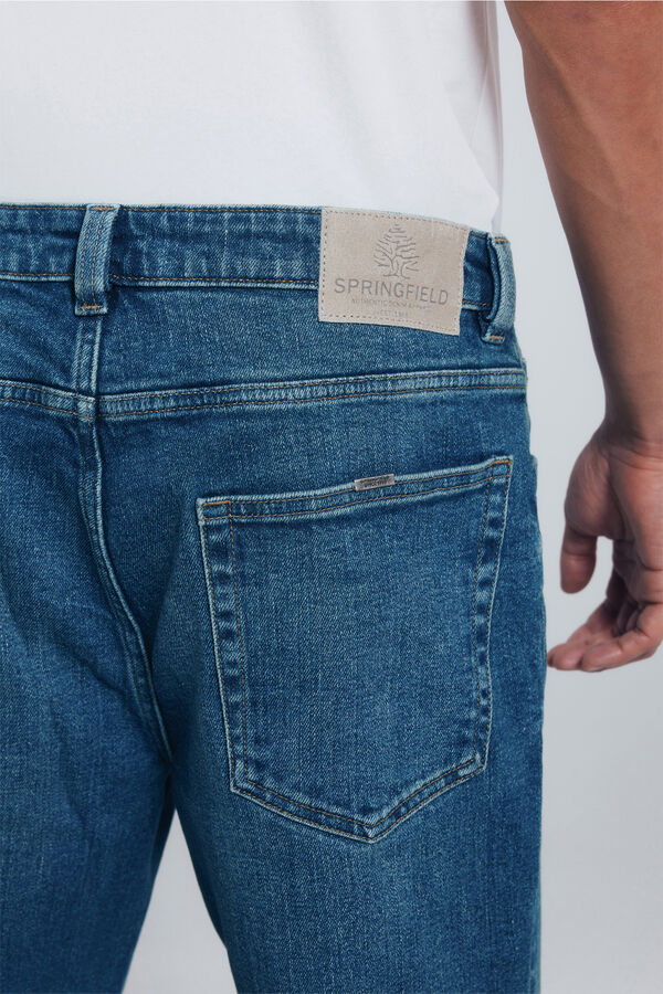 Springfield Calça jeans reta com lavagem escura e tingimento excessivo azul