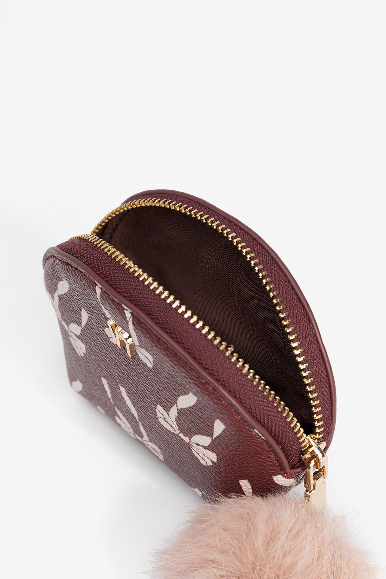 Vilanova Malinha efeito pele com estampado de la&ccedil;os, fecho de fecho-&eacute;clair e pompom.