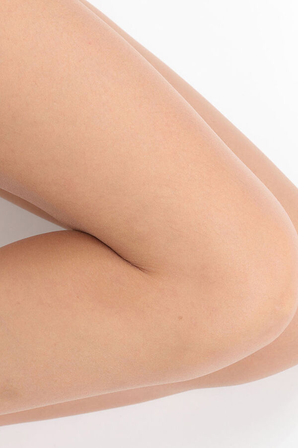DIM Collant de verão Teint de Soleil transparente efeito natural bege